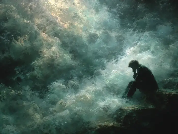 Personne épuisée tête dans les mains, symbolisant le besoin d'un désenvoutement à distance.